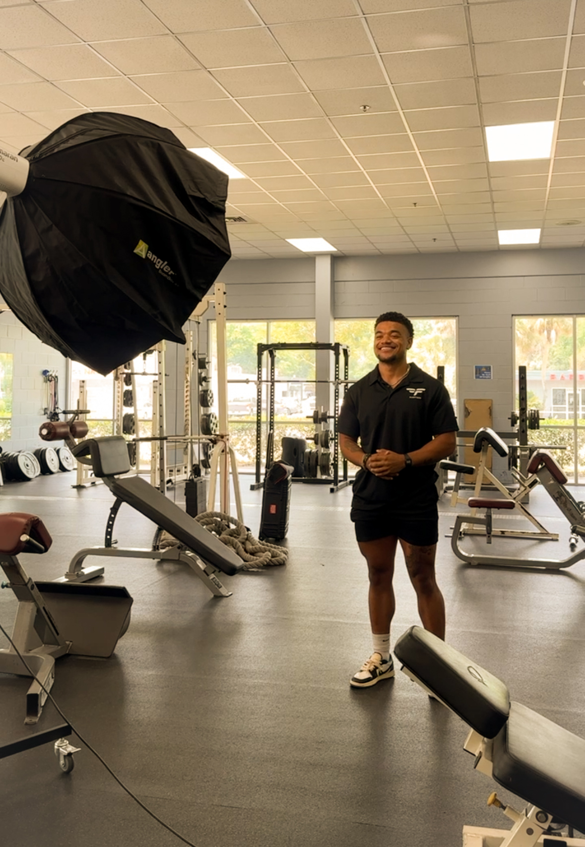 Elevare Agency founder Cameron Hogan filming at a local business